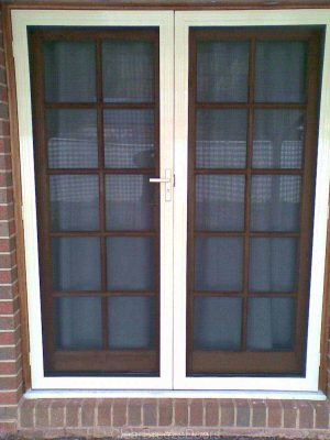 Cb: 14 Clear Breeze Double Security Doors Installed On A French Door Enclosure Closer View.