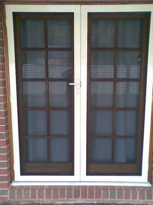 CB: 14 Clear Breeze DoubleSecurity Doors Installed On A French Door Enclosure Closer View.