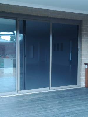 CB: 52 Stacker Sliding Security Doors Fitted With Stainless Steel Mesh. Displaying The Two Security Doors In A Closed Position.