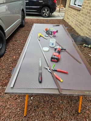 Door & Lock Repairs 11 Brown Screen Door Being Prepared For The Privacy Mesh Installation