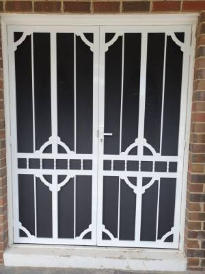 CB: 65 Clear Breeze Steel Double Doors Daylesford 1/SB With Hi Strength Privacy Black Mesh In White.