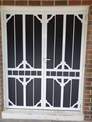 CB: 63 Clear Breeze Steel Double Doors Daylesford 1/SB With Hi Strength Privacy Black Mesh In White.