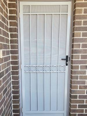 CB:76 Clear Breeze Mansfield Steel Security Door With Standard DVA Privacy In Dune.
