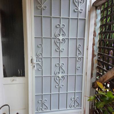 Door:-1 Steel Security Door After The Restoration Powder Coated In Perl White, Installed With Standard Privacy White Mesh.