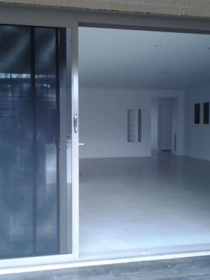 Cb: 53 Stacker Sliding Security Doors Fitted With Stainless Steel Mesh. Displaying The Two Security Doors In A Open Position.