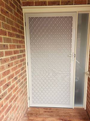 CB: 67 Hinged Screen Door Standard Diamond Grille in Dune With Aluminium Privacy Screen Installed.