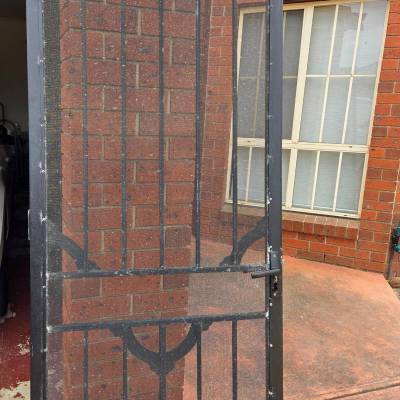 Black Steel Security Door Before The Restoration.